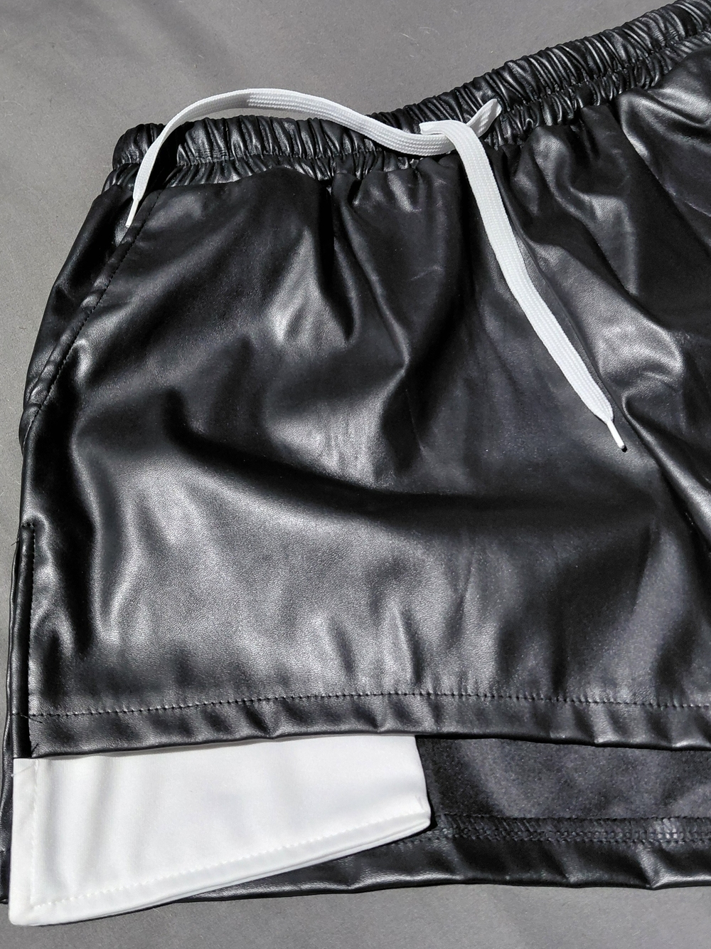 Black Faux Leather Athletic Shorts with White Trim - Picture 2 of 3